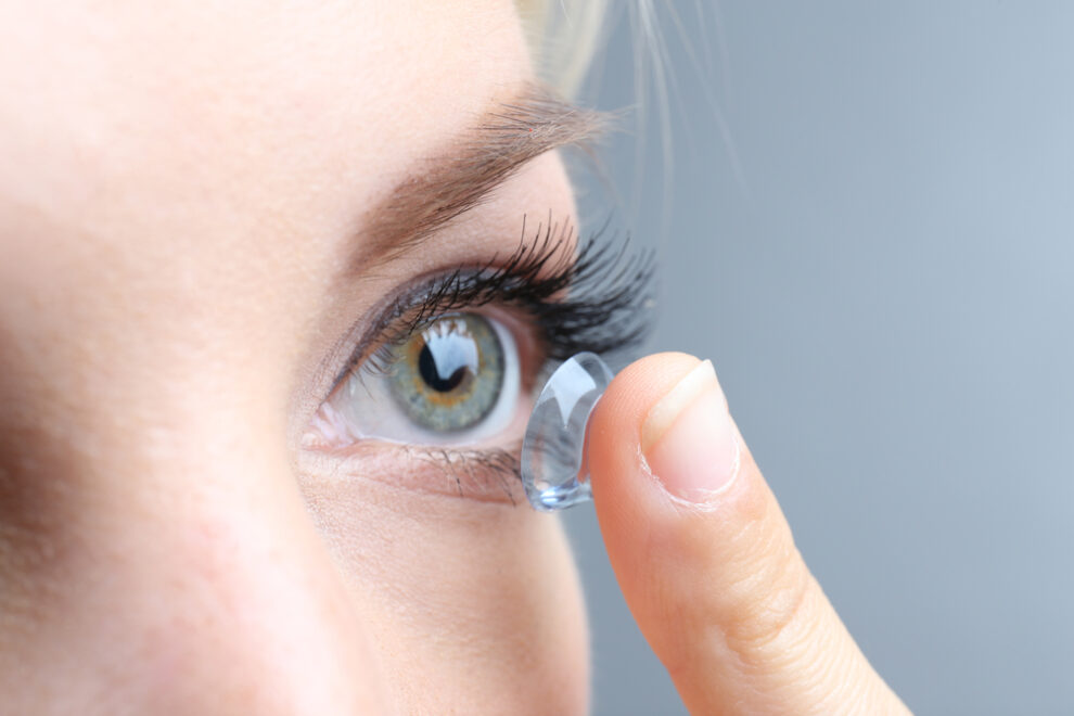 Woman putting in a contact lens