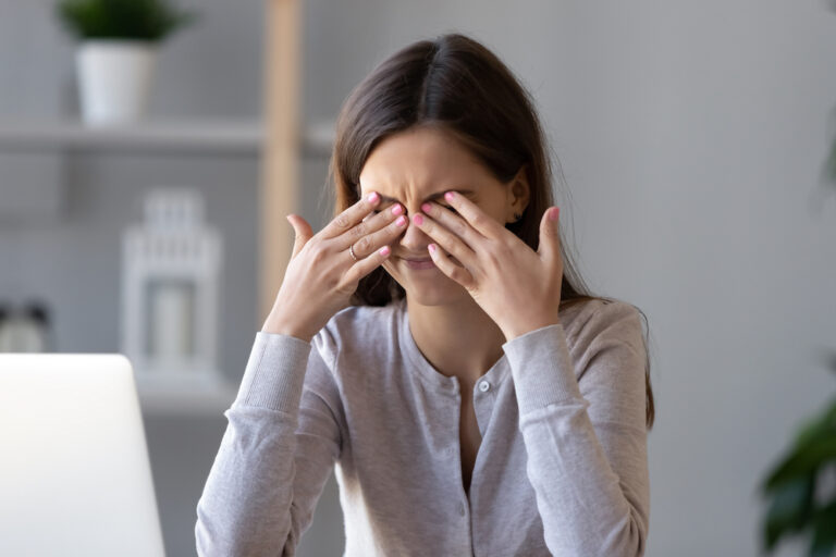 Tired teen girl rubbing dry irritable eyes